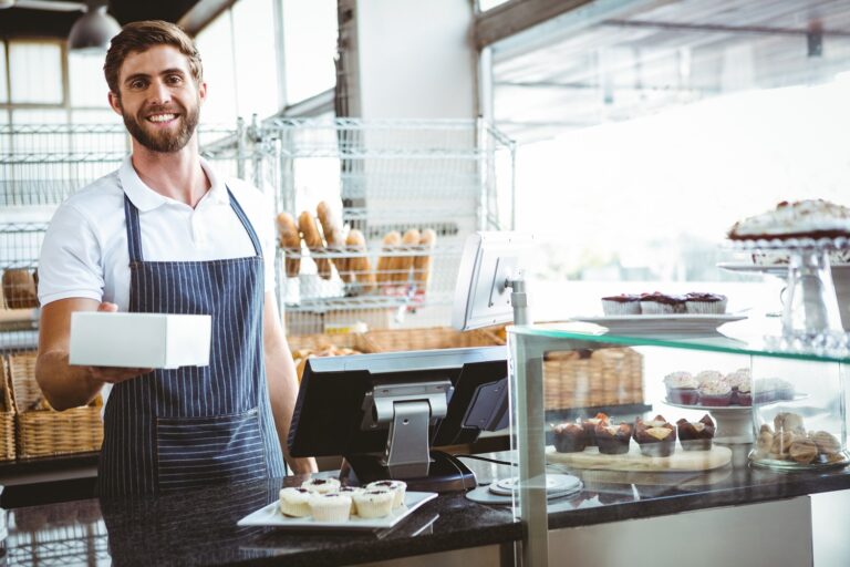 Smiling Worker Prepares Orders At The Bakery - ROCA CONTABILIDADE